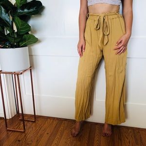 High waisted flowy yellow pants.